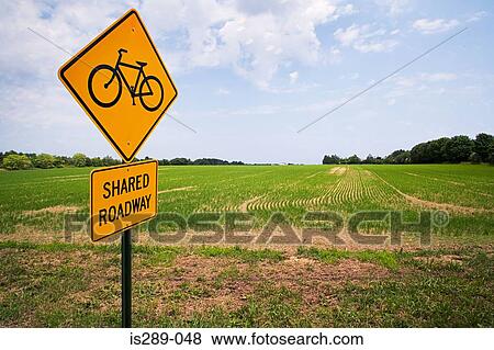 Stock Photo - Road sign by a field. Fotosearch
