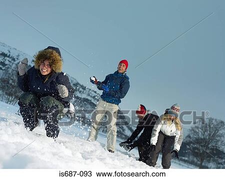 Friends throwing snowballs View Large Photo Image Stock Image - Friends throwing snowballs. Fotosearch