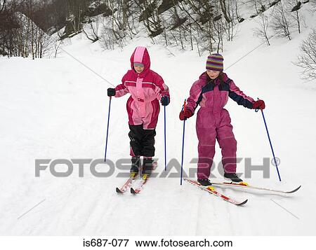 Girls skiing View Large Photo Image Stock Photo - Girls skiing. Fotosearch