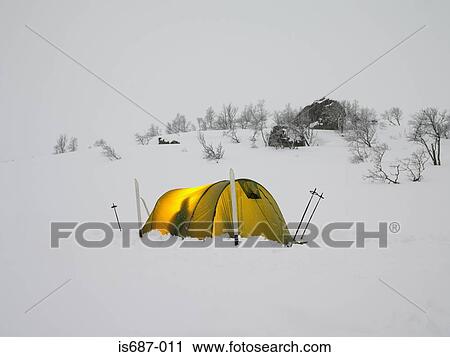 Stock Image - Skiers in a tent. Fotosearch