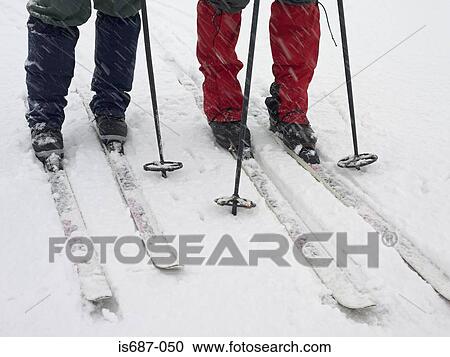 Stock Image - Skiers walking . Fotosearch