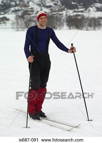 Stock Image - Young man on skis. Fotosearch