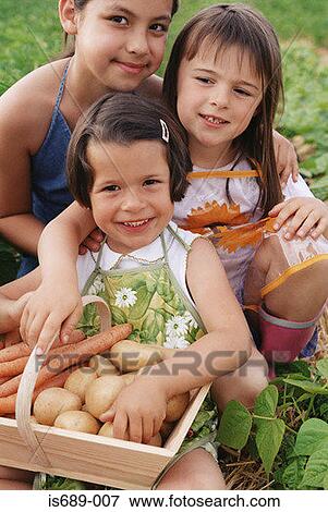 Children with basket of vegetables View Large Photo Image Stock Photo - Children with basket of vegetables. Fotosearch