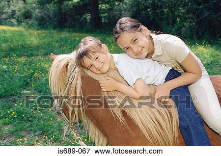 Stock Photo - Friends on a horse. Fotosearch