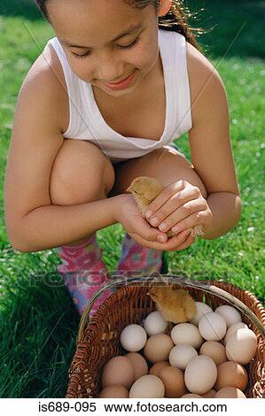 Girl holding a chick View Large Photo Image Stock Photography - Girl holding a chick. Fotosearch