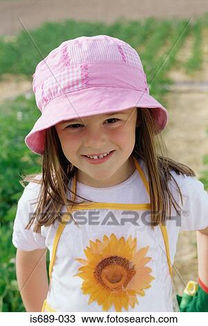 Stock Image - Girl in a garden. Fotosearch