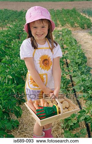 Girl with basket of vegetables View Large Photo Image Stock Image - Girl with basket of vegetables. Fotosearch