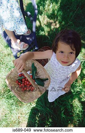 Girls picking berries View Large Photo Image Stock Photo - Girls picking berries. Fotosearch