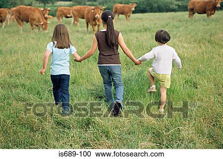 Girls skipping towards cows View Large Photo Image Stock Image - Girls skipping towards cows. Fotosearch