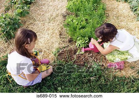 Two girls gardening View Large Photo Image Stock Photography - Two girls gardening. Fotosearch