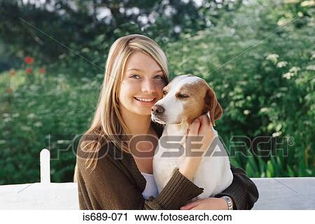Young woman with pet dog View Large Photo Image Stock Image - Young woman with pet dog. Fotosearch