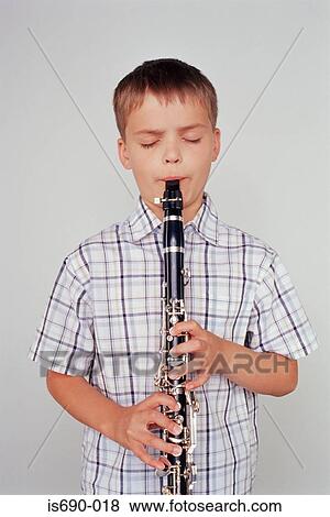 Boy playing the clarinet View Large Photo Image Stock Photo - Boy playing the clarinet. Fotosearch