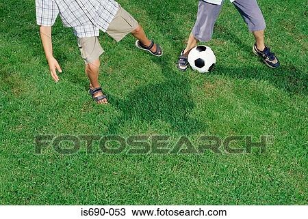 Boys playing football View Large Photo Image Stock Image - Boys playing football. Fotosearch