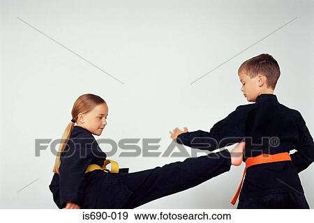 Girl and boy practicing karate View Large Photo Image Stock Photo - Girl and boy practicing karate. Fotosearch