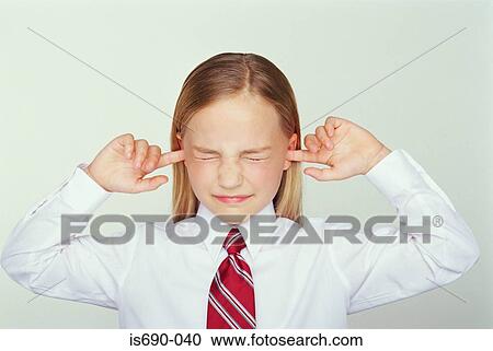 Girl putting her fingers in her ears View Large Photo Image Stock Image - Girl putting her fingers in her ears. Fotosearch
