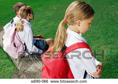 Stock Photograph - Girl separate from other children. Fotosearch