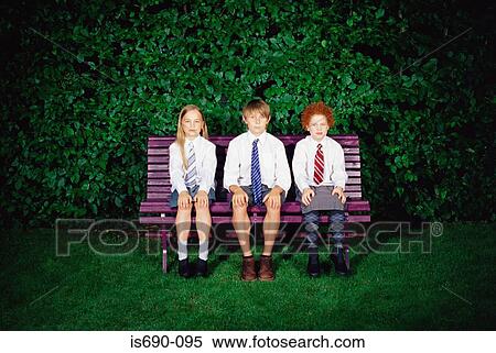 Schoolchildren on a bench View Large Photo Image Stock Photography - Schoolchildren on a bench. Fotosearch