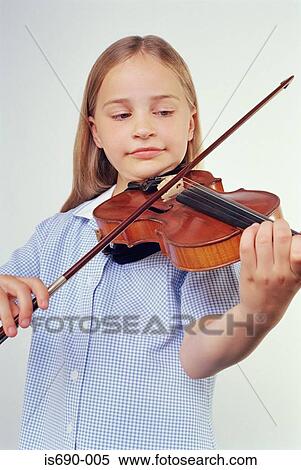 Schoolgirl playing the violin View Large Photo Image Stock Photography - Schoolgirl playing the violin. Fotosearch