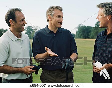 Golfers having a discussion View Large Photo Image Stock Photo - Golfers having a discussion. Fotosearch