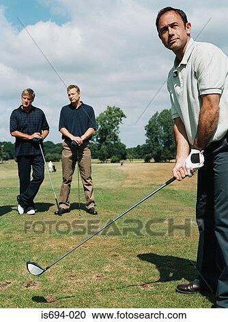 Men playing golf View Large Photo Image Stock Image - Men playing golf. Fotosearch