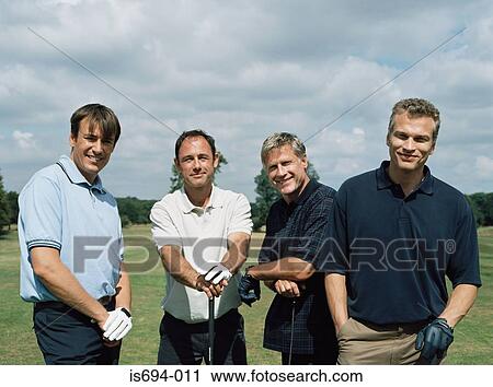 Rear view of four golfers View Large Photo Image Stock Image - Rear view of four golfers. Fotosearch