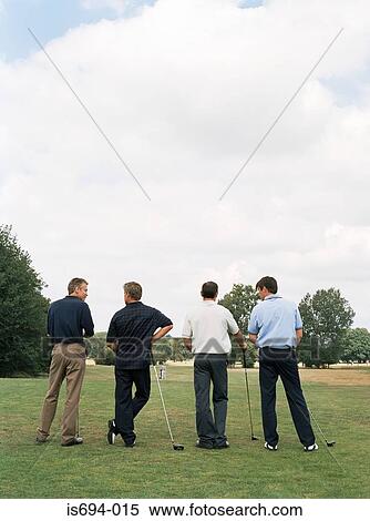 Rear view of four golfers View Large Photo Image Stock Photography - Rear view of four golfers. Fotosearch