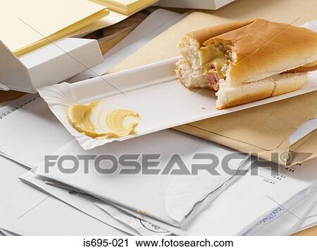 Baguette on a paper tray with mustard View Large Photo Image Stock Image - Baguette on a paper tray with mustard. Fotosearch