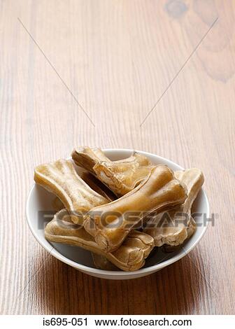 Dog bones in a bowl View Large Photo Image Stock Image - Dog bones in a bowl. Fotosearch