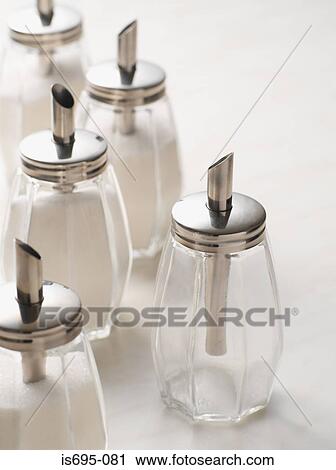 Stock Image - Five sugar shakers. Fotosearch