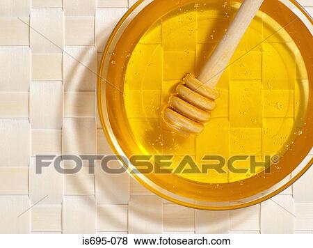 Honey with dipper View Large Photo Image Stock Photo - Honey with dipper. Fotosearch