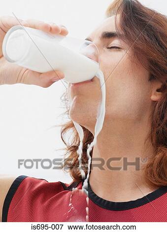 Stock Photo - Man drinking a glass of milk. Fotosearch