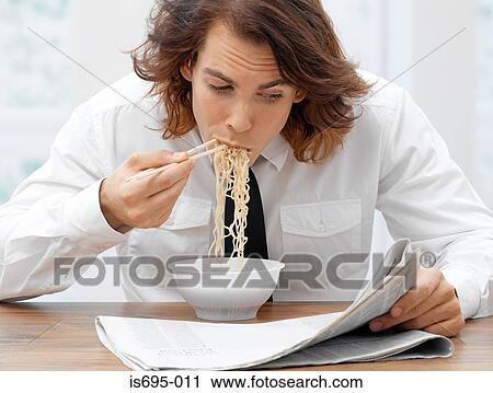 Office worker eating spaghetti View Large Photo Image Stock Image - Office worker eating spaghetti. Fotosearch