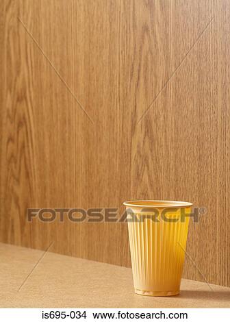 Plastic cup on a desk View Large Photo Image Picture - Plastic cup on a desk. Fotosearch