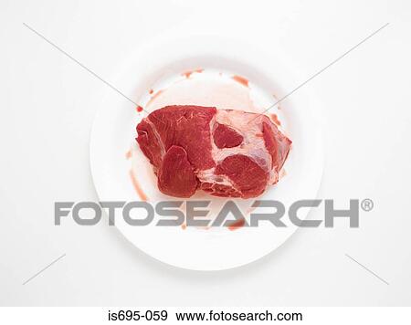 Stock Photo - Raw beef on a plate. Fotosearch