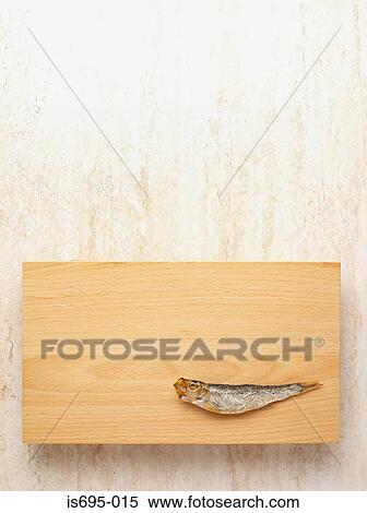 Sardine on a cutting board View Large Photo Image Stock Photography - Sardine on a cutting board. Fotosearch