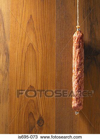 Sausage hanging on a piece of string View Large Photo Image Stock Image - Sausage hanging on a piece of string. Fotosearch
