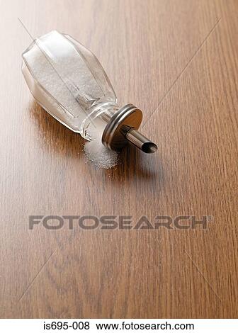 Sugar shaker on a wooden table View Large Photo Image Stock Photo - Sugar shaker on a wooden table. Fotosearch