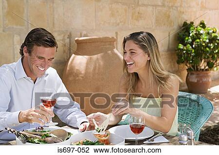 Couple dining al fresco View Large Photo Image Stock Image - Couple dining al fresco. Fotosearch