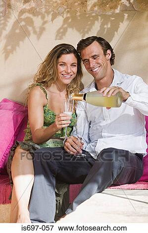 Couple having some wine View Large Photo Image Stock Photo - Couple having some wine. Fotosearch