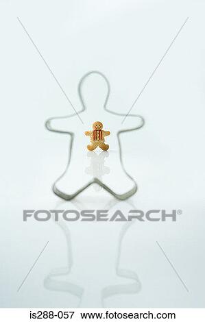 Gingerbread man and cookie cutter View Large Photo Image Stock Photo - Gingerbread man and cookie cutter. Fotosearch