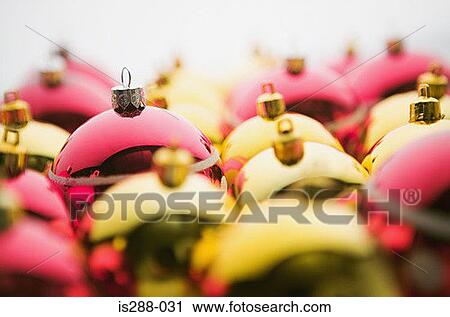 Stock Image - Red and golden baubles. Fotosearch