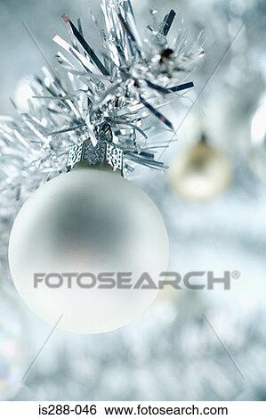 Silver bauble on a christmas tree View Large Photo Image Stock Photograph - Silver bauble on a christmas tree. Fotosearch