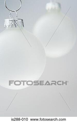 Stock Image - White baubles. Fotosearch