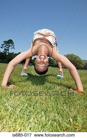 Woman bending over backwards View Large Photo Image Stock Photo - Woman bending over backwards. Fotosearch