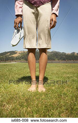 Woman holding sandals View Large Photo Image Stock Photo - Woman holding sandals. Fotosearch