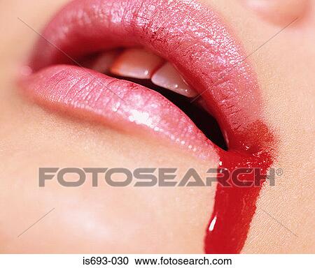 Blood spilling from woman's mouth View Large Photo Image Stock Image - Blood spilling from woman's mouth. Fotosearch