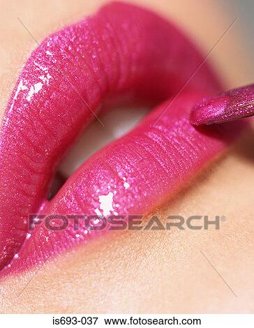 Putting on pink lipgloss View Large Photo Image Stock Photo - Putting on pink lipgloss. Fotosearch