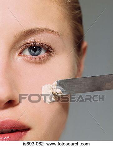 Woman applying facial mask View Large Photo Image Stock Image - Woman applying facial mask. Fotosearch