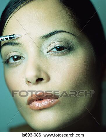 Woman having a BOTOX ® injection View Large Photo Image Stock Photograph - Woman having a BOTOX ® injection. Fotosearch