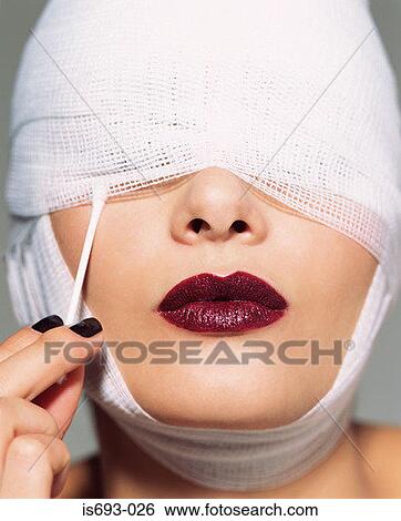 Woman putting cotton bud under bandage View Large Photo Image Stock Photograph - Woman putting cotton bud under bandage. Fotosearch